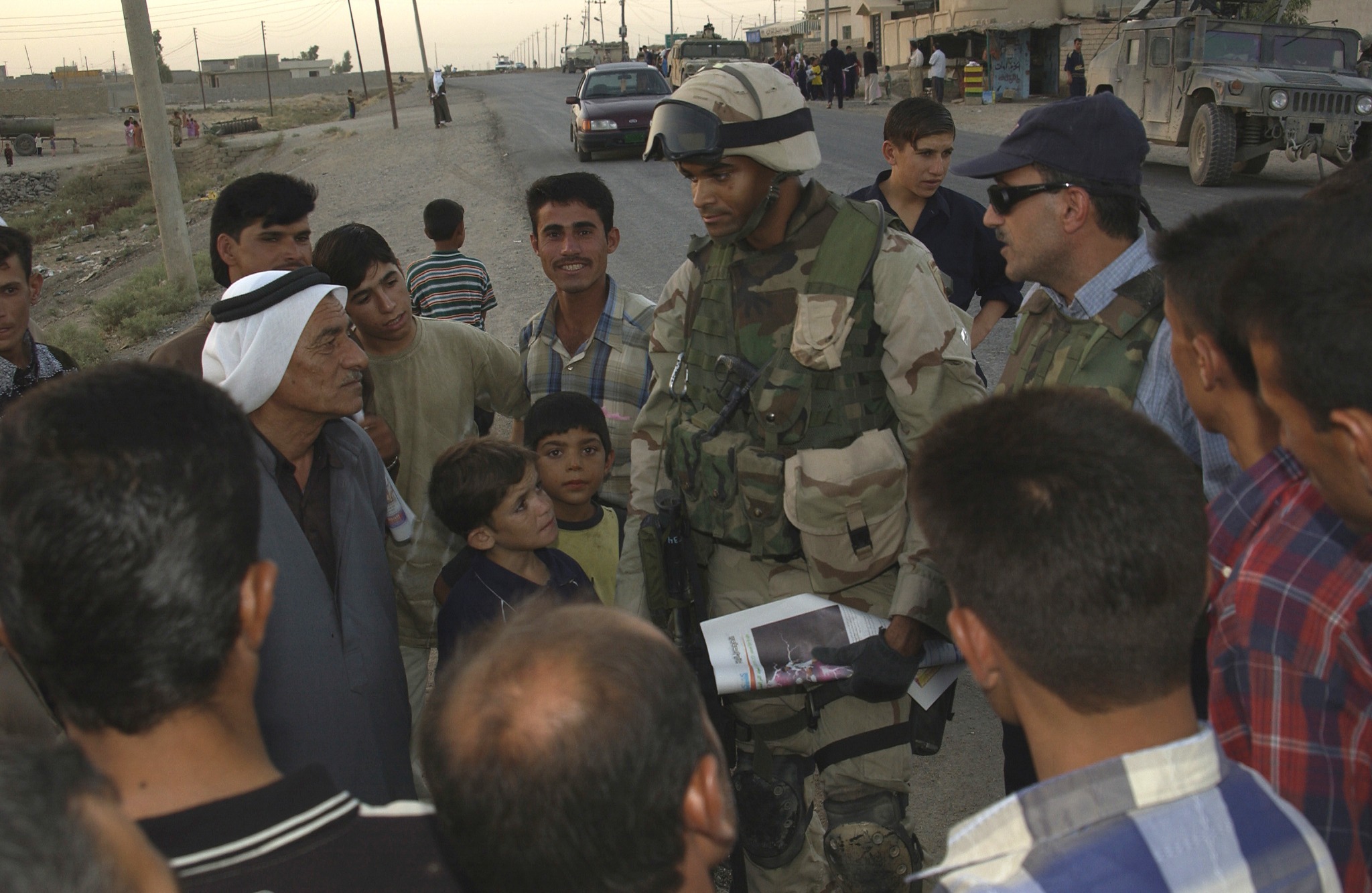 eli williamson in uniform speaking with a group during his deployment to Iraq