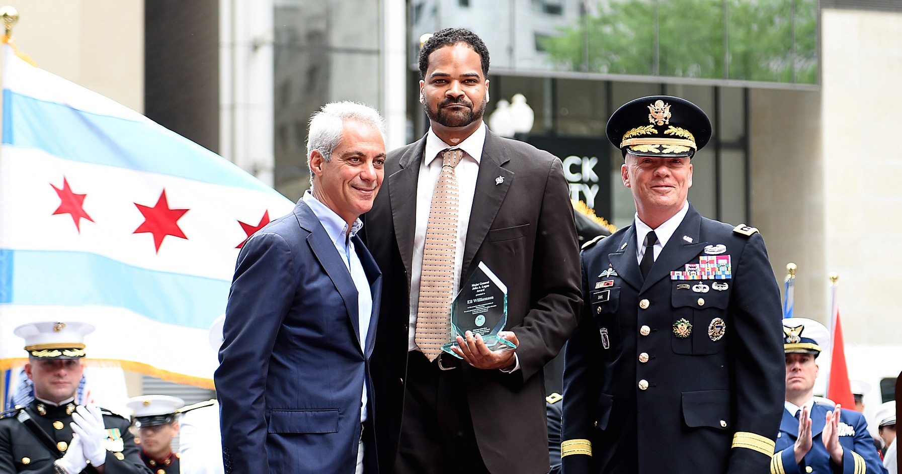 eli williamson holding the Major General John A. Logan Patriot Award at Chicago’s Memorial Day ceremony
